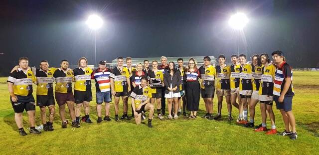 The victorious Pirates under-17s side with coach Jeremy Maslen, 'old boys' coach Matt Grinter and the Cutcliffe family.