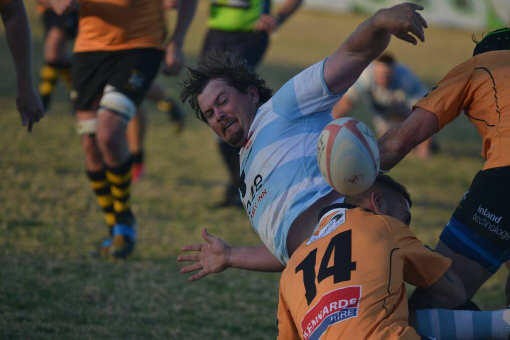 Quirindi centre Jake Murray gets the offload away.