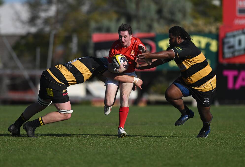 Mitch Mack and Jioji Cakacaka form a double team to stop Gunnedah five-eighth Marcus Hayne. Picture by Gareth Gardner