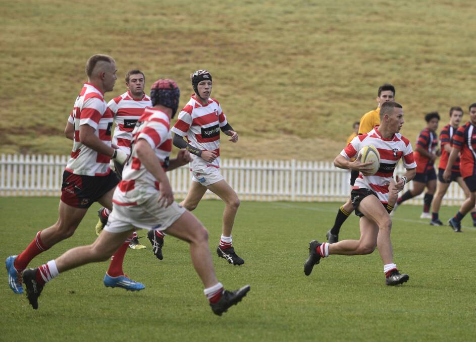 Half-back Flynn Bower, here enroute to scoring, was prominent for the Central North colts on the weekend.