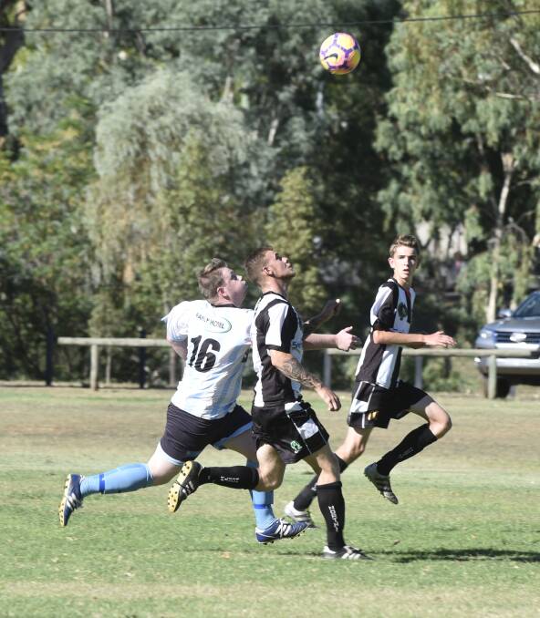 Tamworth FC's Sam Williams and North Companions' Zach Kam compete for this header during Saturday's FFA Cup clash.
