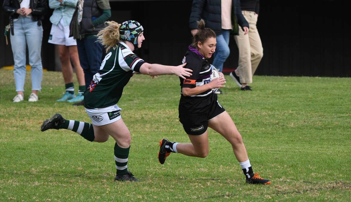 Elusive: Flo Davidson slips past the Robb defence for one of her two tries. Photo: Sean Walker
