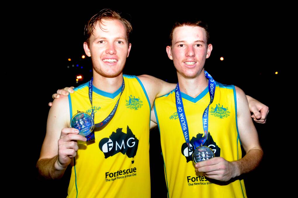Champions: Isaac Farmilo and Ehren Hazell with their gold medals following the Australian under 21s Sultan of Johor Cup triumph.