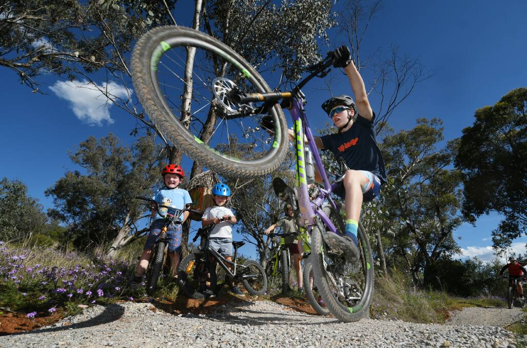 Wheels up: Mountain biker Lachie Butters shows off some of his skills ahead of the start of the twilight series on Wednesday. Photo: Gareth Gardner 191021GGD03