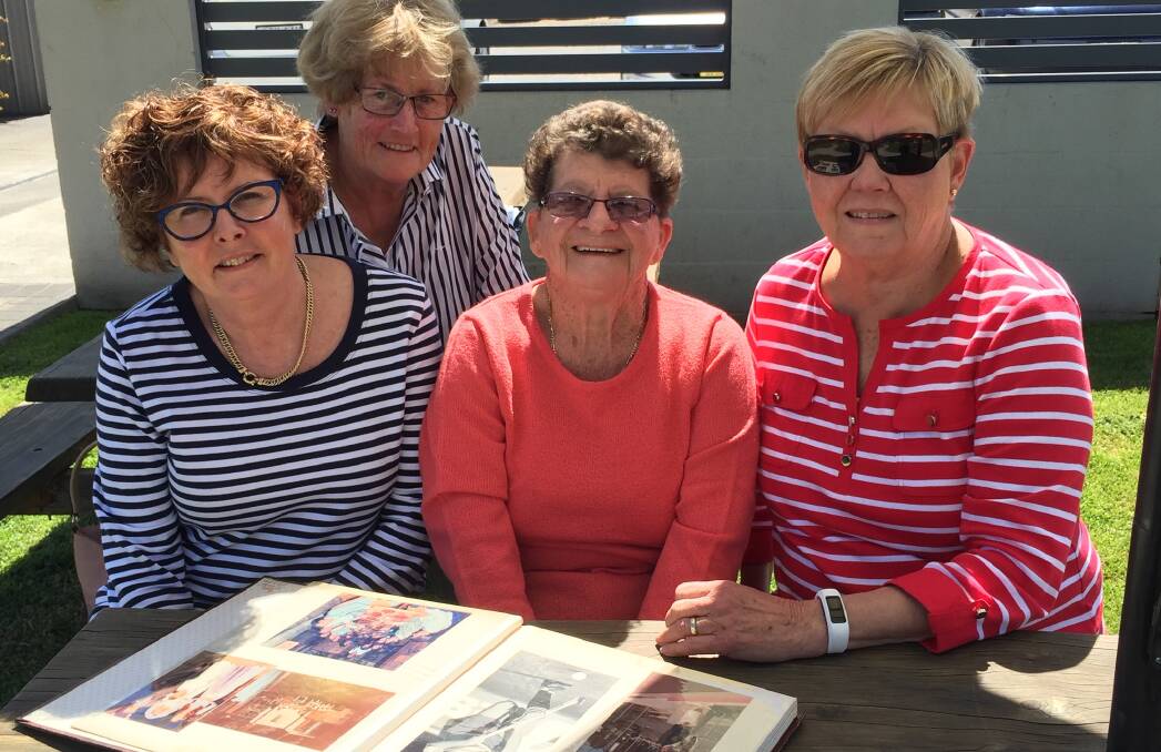 History: (L-R) Former players Wendy Kelly, Karen Doyle, Dot Burgess and Robyn Lasker comb through some of Olympians' history ahead of this month's reunion.