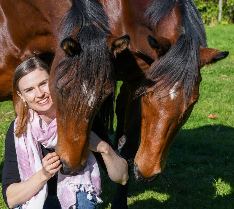 A special bond: Medal Of Glory and Mr Pumblechook have become part of Rachael Murray's extended family since their days on the track finished. Photo: Daryl Duckworth