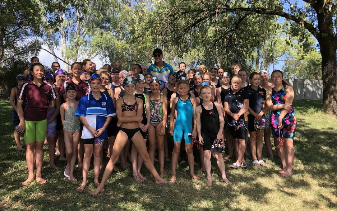 World Championship bronze medallist Kurt Herzog poses with swimmers at the weekend's Tamworth City Swimming carnival.