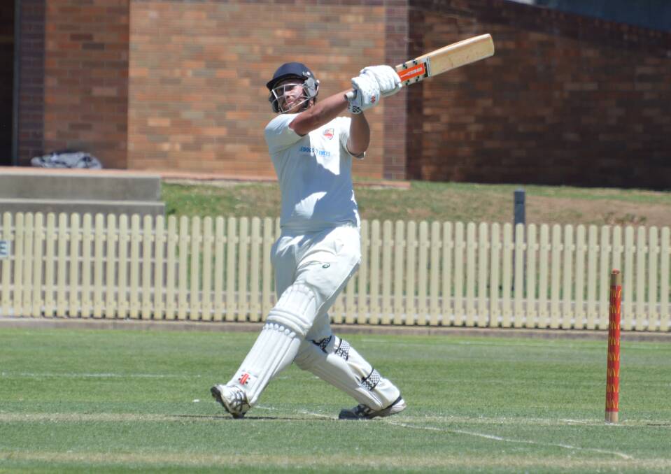 Sweetly struck: Bryan Warren bombs this ball over Kable Avenue during his 39 for Tamworth on Sunday. 