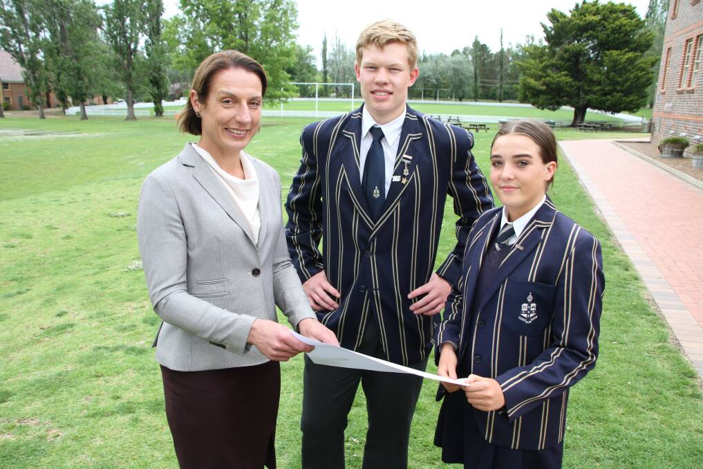 For a good cause: Principal Dr Rachel Horton, Alexander Zuber and Lettie Kerr discuss the course of the 19km 'TAS 4 Hour' fun run
