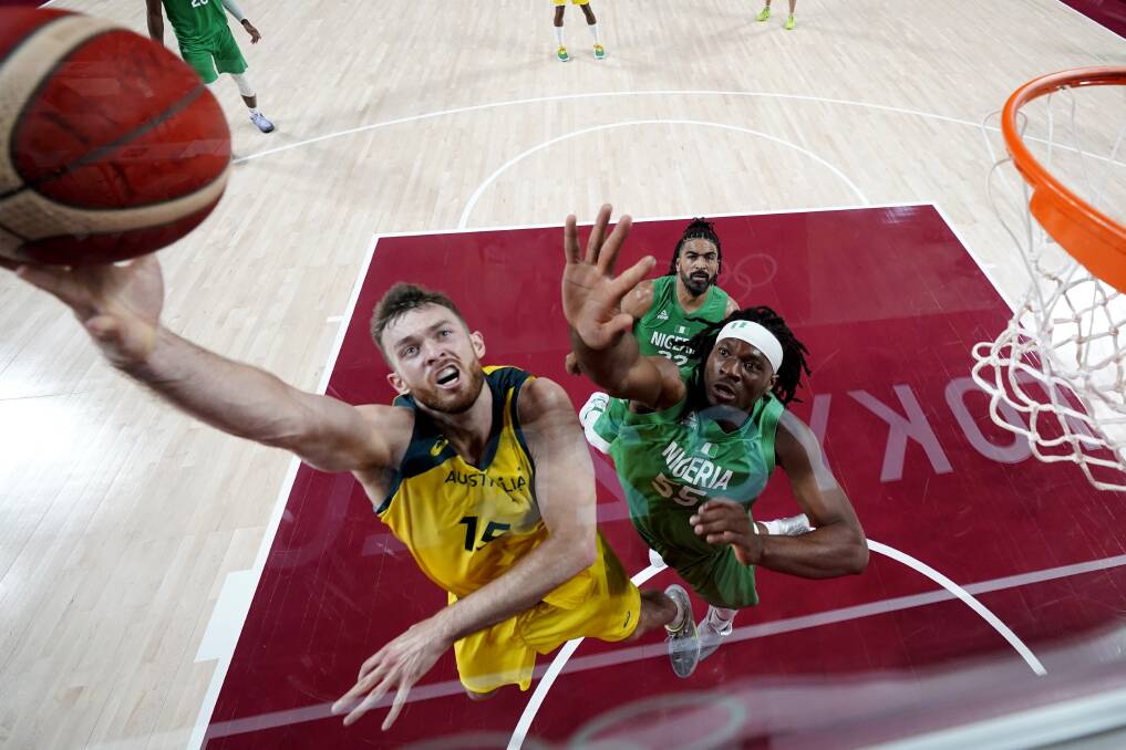 Game on: Nick Kay shoots past Nigeria's Precious Achiuwa for one of his five field baskets during their opening round clash on Sunday. Photo: AP Photo/Eric Gay