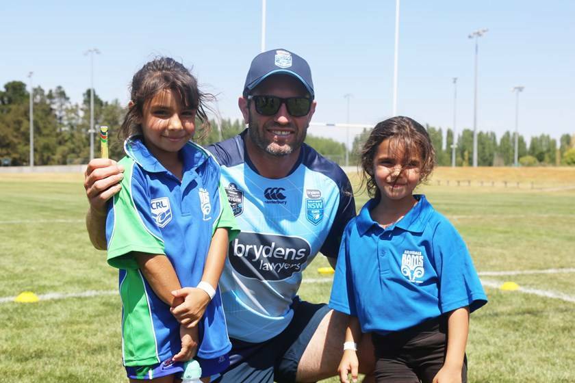 Former Newcastle Knights, NSW and Kangaroos star Danny Buderus poses with young fans during last month's State of Origin camp in Armidale. He will be returning to the region with Brad Fittler's Hogs For The Homeless tour.