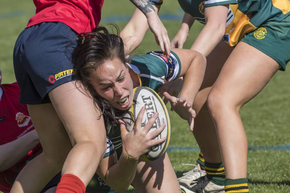 Rhiannon Byers reaches out through the Gunnedah defence to score the opening try of Saturday's grand final. Photo: Peter Hardin