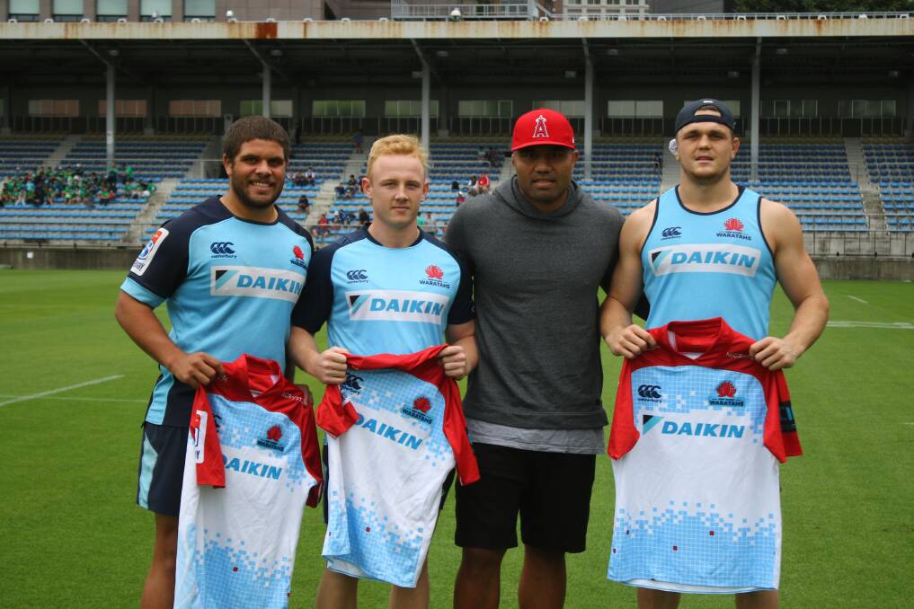 Dream come true: Will McDonnell (second from left) after being presented his jersey by Waratah's centurion Wycliff Palu (second from right). Photo: Jamie Conroy/NSW Waratahs Media