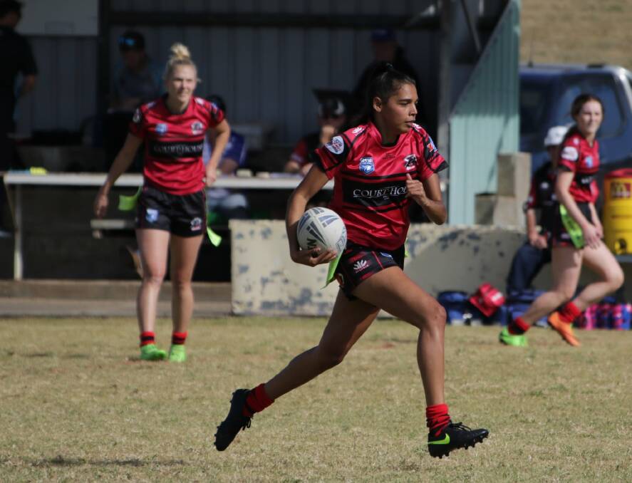 Catch me if you can: Dhalara Knox races away to score one of her three tries in North Tamworth's big win over Barraba. Photo: Judy McManus