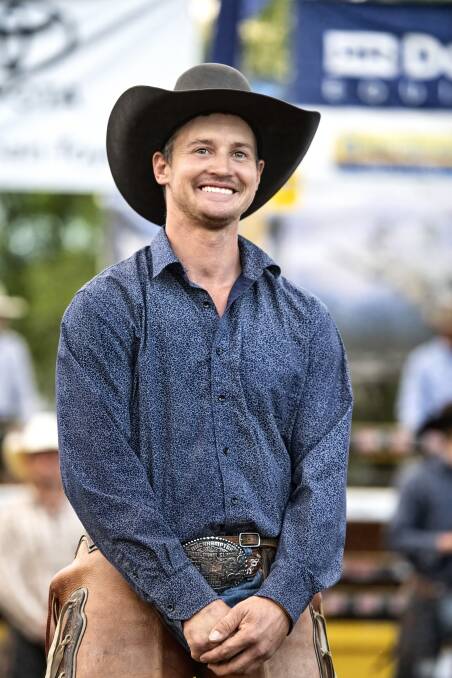 Cue the celebrations: Greg Hamilton had plenty of reasons to smile after taking out the open bronc event. Photo: BootFace Photography.