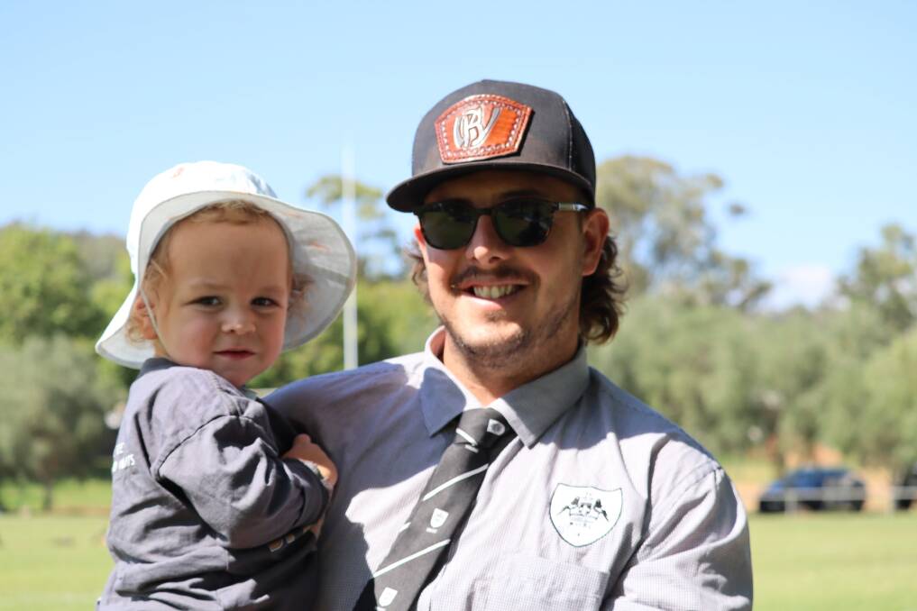 Ben Watts, pictured here with son Koa, is returning for his second season coaching the Magpies women. Picture by Emma Bailey.