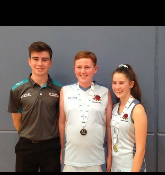 Hockey New England's contingent at the under-13 indoor nationals: (L-R) Aiden Wicks (umpire), Elliot Clarke and Pip Constable.