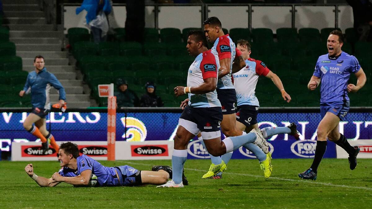 Try-time: Alex Newsome celebrates after scoring the opening try in the Western Force's 29-point demolition of the Waratahs on Saturday night. Photo: Will Russell/Getty Images