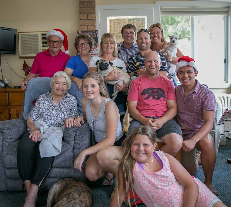 TREASURED MOMENTS: Anne (back, blue shirt) celebrates Christmas with her family in 2016.
