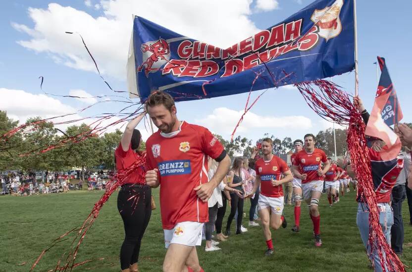 Perrett leads the Red Devils onto the field for their first home grand final in 50 years in 2022. Picture by Peter Hardin