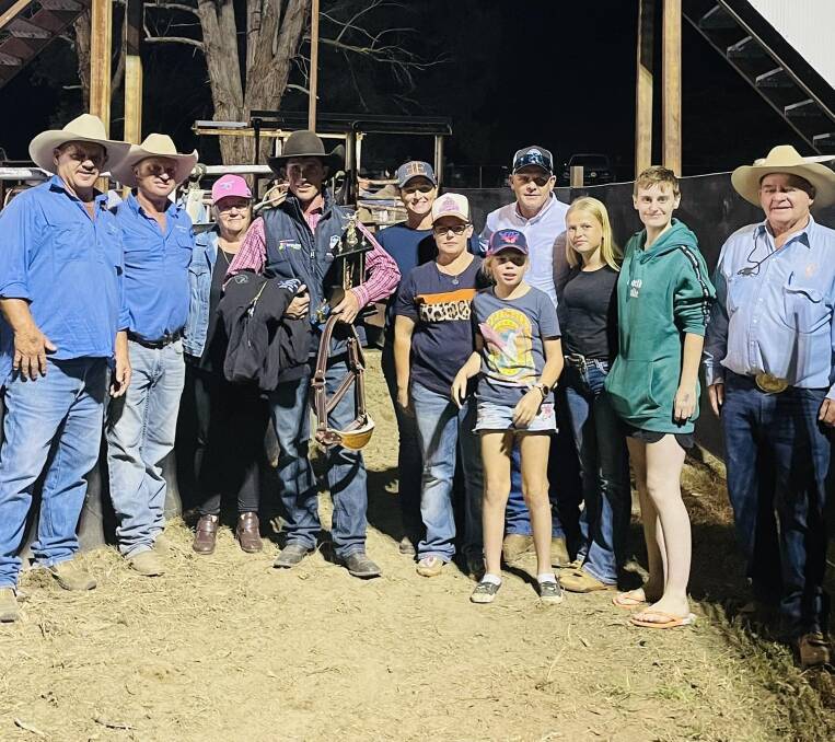 Brody Cummins with Peter Jenner's family after taking out the 2024 Peter Jenner Memorial Saddle Bronc. Picture Bendemeer Rodeo and Campdraft Facebook.