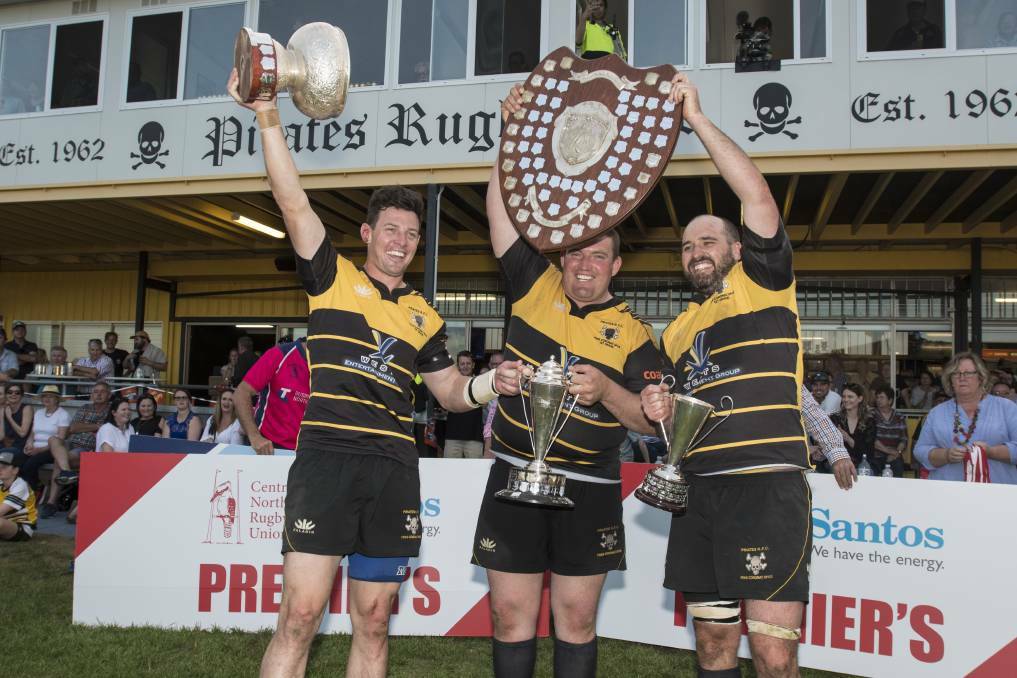 (L-R) Brendan Rixon, Ben Goodman and skipper Conrad Starr hold Pirates' trophy haul aloft. While Rixon and Goodman have hung up the boots, Starr is on deck again for 2019. Photo: Peter Hardin