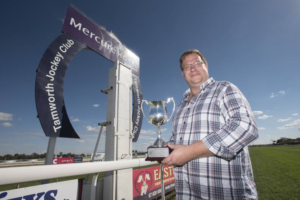 Prized possession: Tamworth Jockey Clubs interim general manager Wade Berryman with the Mercure Tamworth Cup. Photo: Peter Hardin