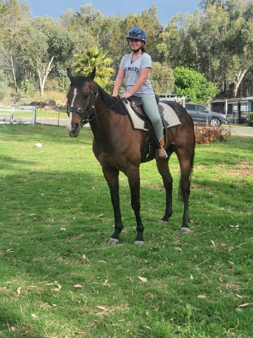 Leisurely life: Todd Paynes daughter, Rylie, looks pleased to have Newcastle Dancer as her pony, after the 10-year-old retired as a winner at Inverell on Saturday.