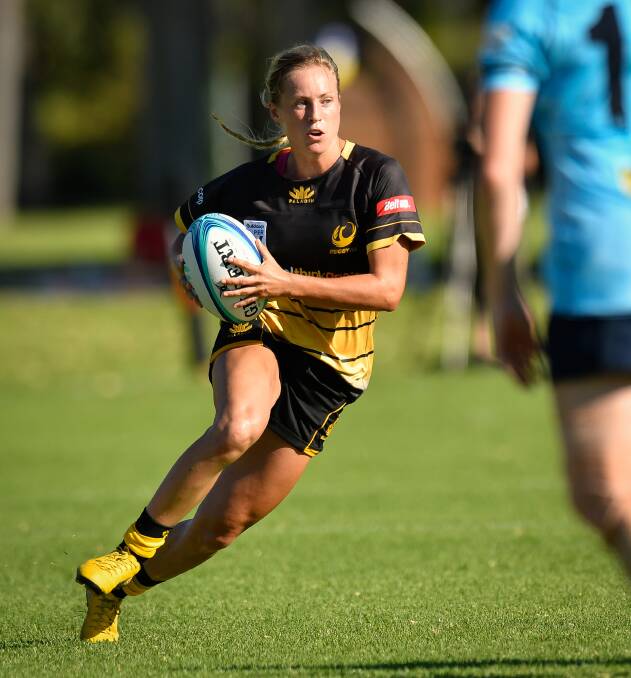 Nielsen puts some footwork on. Photo: RugbyAU media