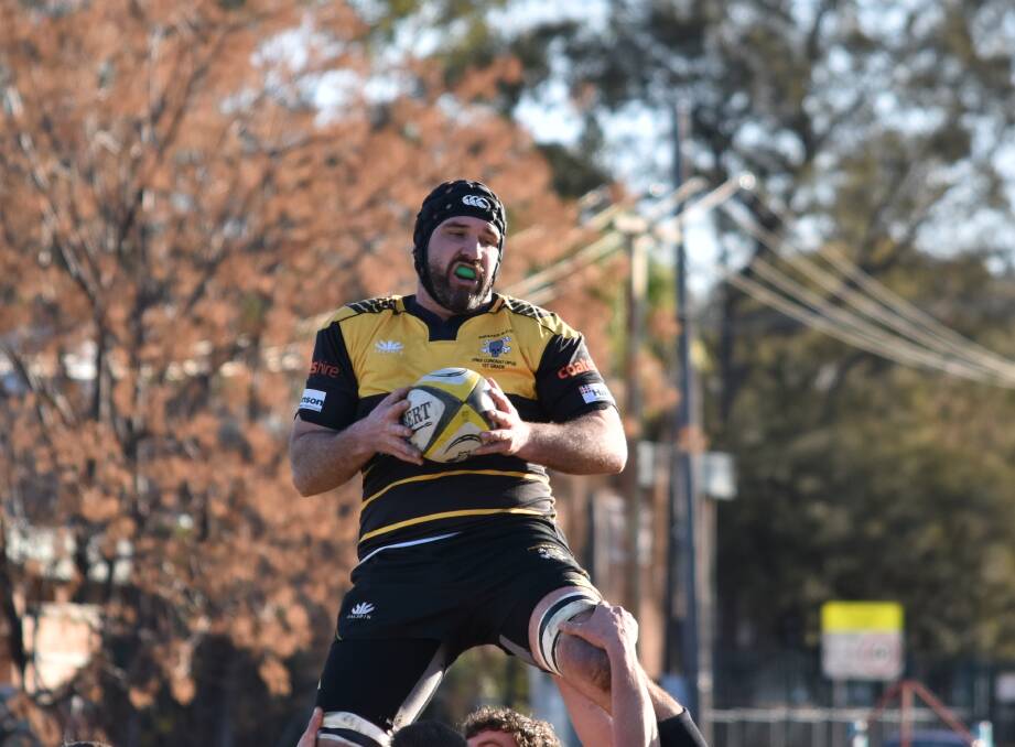 Soaring above the pack: Pirates skipper Conrad Starr's hat-trick helped the premiers return to the winners circle on Saturday. Photo: Ben Jaffrey