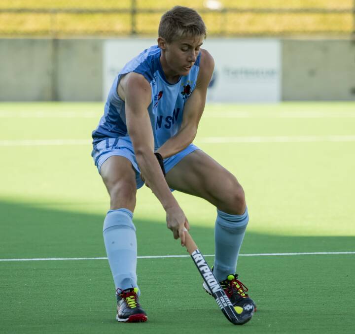 On the ball: Sam Liles' big year is set to continue next month when he plays for Australia at the Junior World Cup in India. He's here in action for the NSW Waratahs during the recent AHL.Photo: Click InFocus