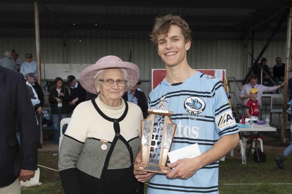 Narrabri young gun Felix Cobb-Johnson capped off a great season by winning the Richard Cameron Memorial Award as zone's best under-21s player. He is pictured here being presented the trophy by Richard's mother, and Central North Life Member, Helen Cameron. Picture by Peter Hardin