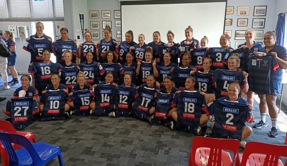 Down to business: The Melbourne Rebels Super W squad receive their jerseys. Photo: Melbourne Rebels Facebook