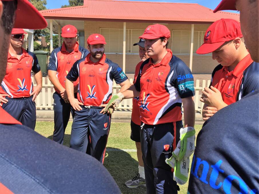 Final instructions: Central North captain Tom Groth addresses his side before their clash against Newcastle. Photo: Heidi Gibson