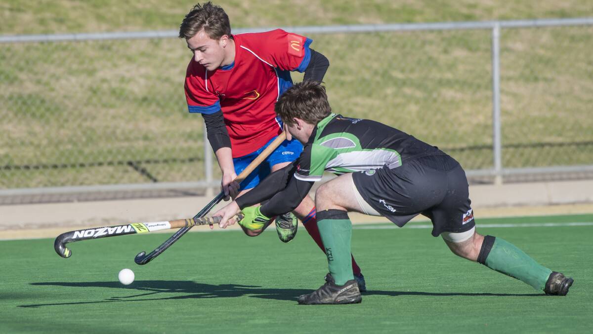 South United's Harper Galvin attempts to evade the Kiwis defence. Photo: Peter Hardin