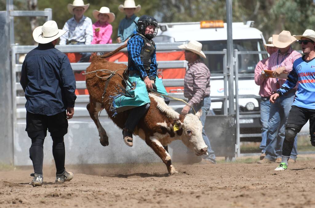 Top ride: Linden Raaen sticks it out for the eight seconds to win the 11-under-14 steer ride. Photo: Gareth Gardner