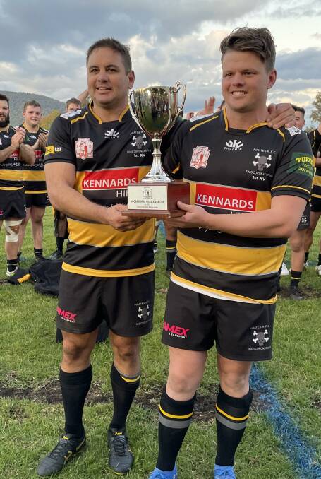 Last hurrah: Moodie (left) holds the Kookaburra Challenge Cup with captain for the day Tim Collins following their win over Moree on Saturday.