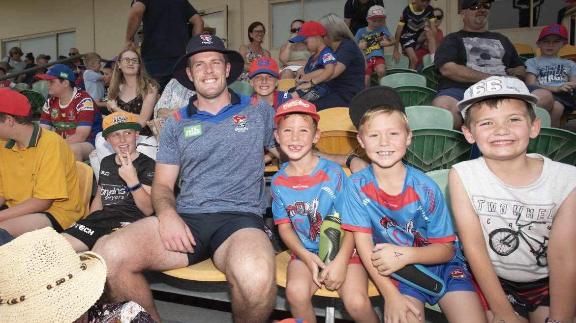 King of the kids: Knights second-rower Lachlan Fitzgibbon with fans at the training clinic during their 2019 visit to Tamworth. Photo: Peter Hardin 171219PHD002