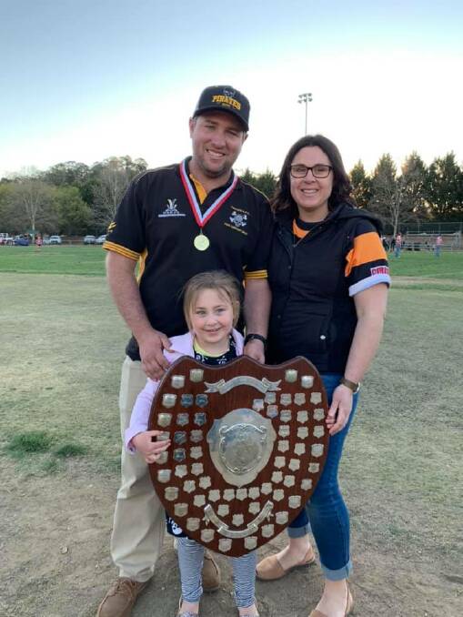 Perfect way to finish: Pirates coach Mat Kelly with wife Eryn and daughter Piper after Pirates' grand final win. Making it four premierships in four years, it turned out to be Kelly's last game in charge. 