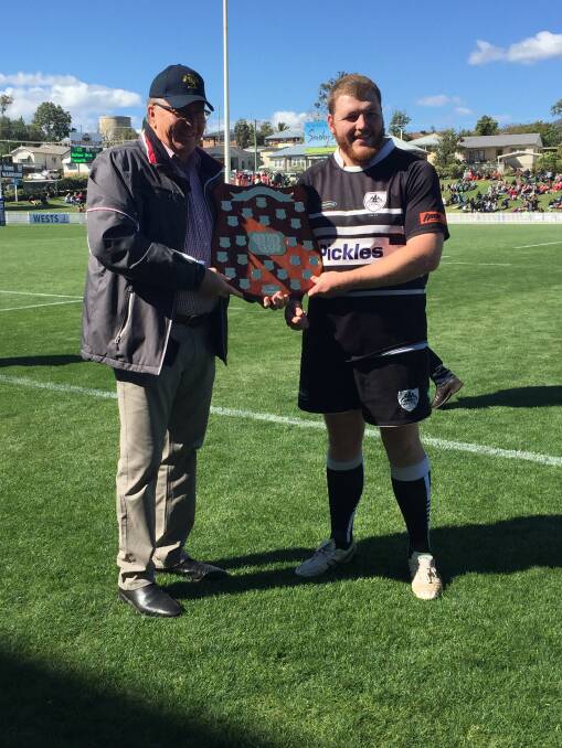 Proud as punch: Tamworth skipper Rory Marshman receives the silverware from Tamworth mayor Col Murray.