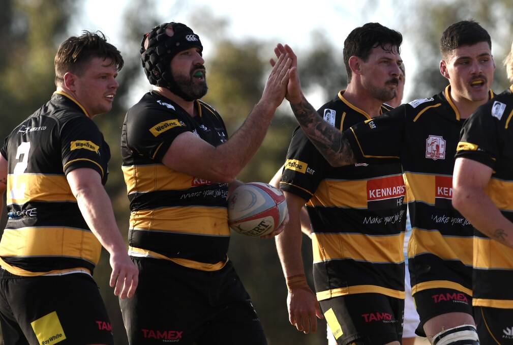 Taggart, pictured here high-fiving with Pirates skipper Conrad Starr during an earlier clash, has consistently been among their best this season. Picture by Gareth Gardner