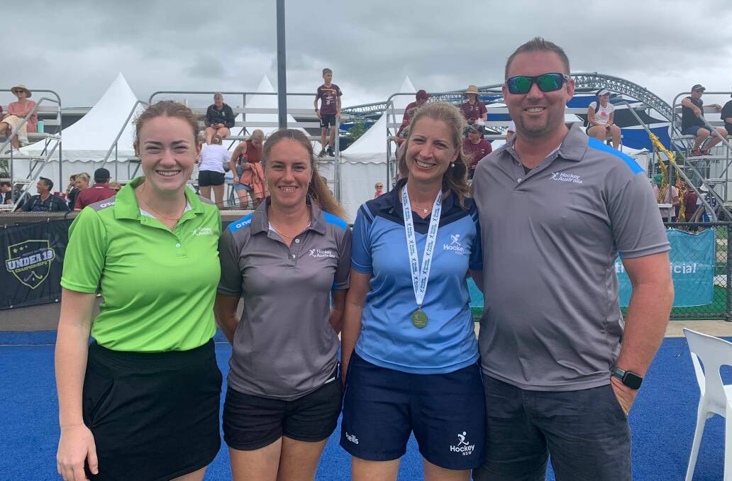 On duty: Sarah Willis (umpire), Tracey Fischer (technical official), Dane James (assistant umpire manager) and Jenny Taggart (State boys team manager) were on deck at the under-18s nationals in Cairns. Photo: Tamworth Hockey Association Facebook 