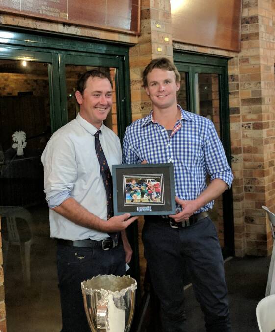 Will Maunder (right) accepts his second grade players' player award from coach Andrew Ceeney.