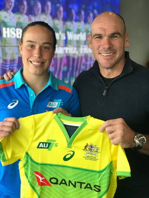 Inverell's Rhiannon Byers receives her Australian jersey from Nathan Grey ahead of her debut in Biarritz this weekend.