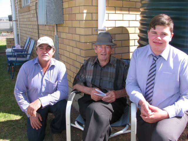 Lifelong passion: Trevor Smith (middle) with with son Greg (left) and grandson Lachlan at a race meeting.
