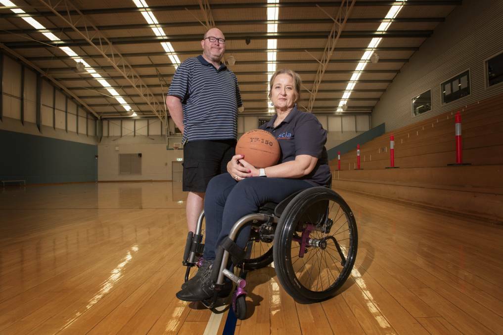 Have a spin: Tamworth Wheelchair Sports are holding a series of come-and-try evenings starting this Wednesday. Pictured are committee members David Plummer and Catherine Rae. Photo: Peter Hardin 071020PHD009