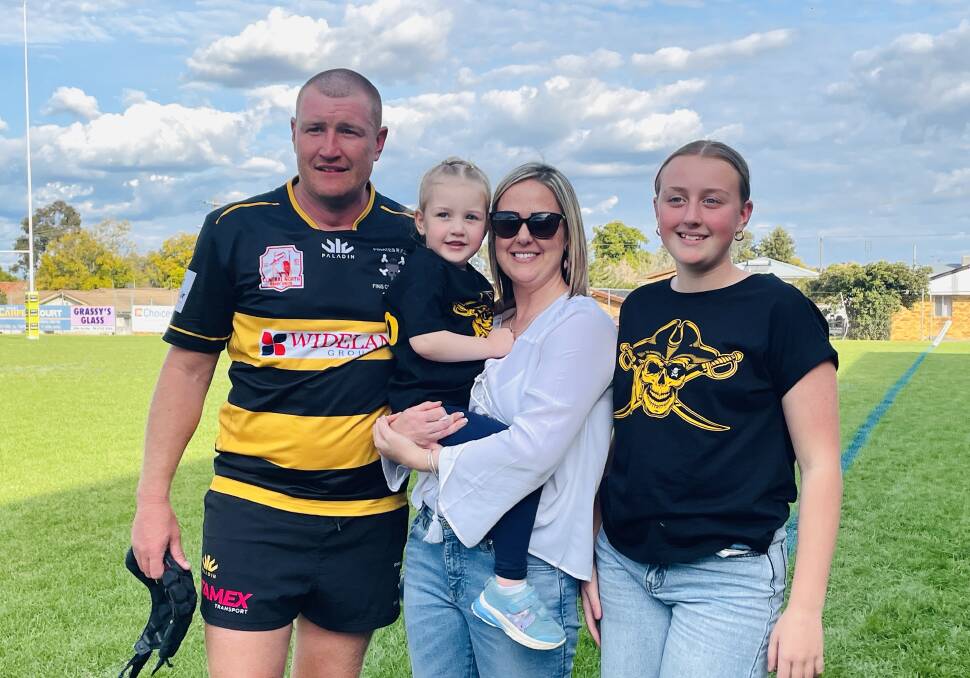 Simon Trappel with daughter Elsie, wife April and daughter Millie after becoming the first person to play 300 games for Pirates.
