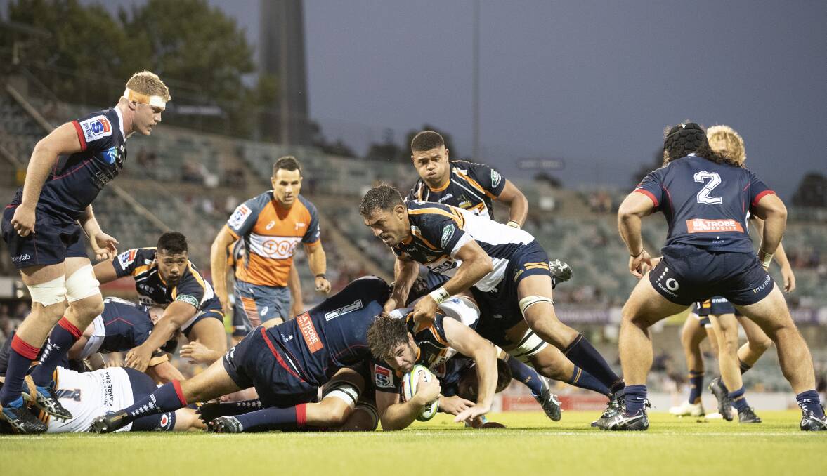 Carter takes the ball up during the Brumbies' opening round clash with the Melbourne Rebels. Photo: Sitthixay Ditthavong