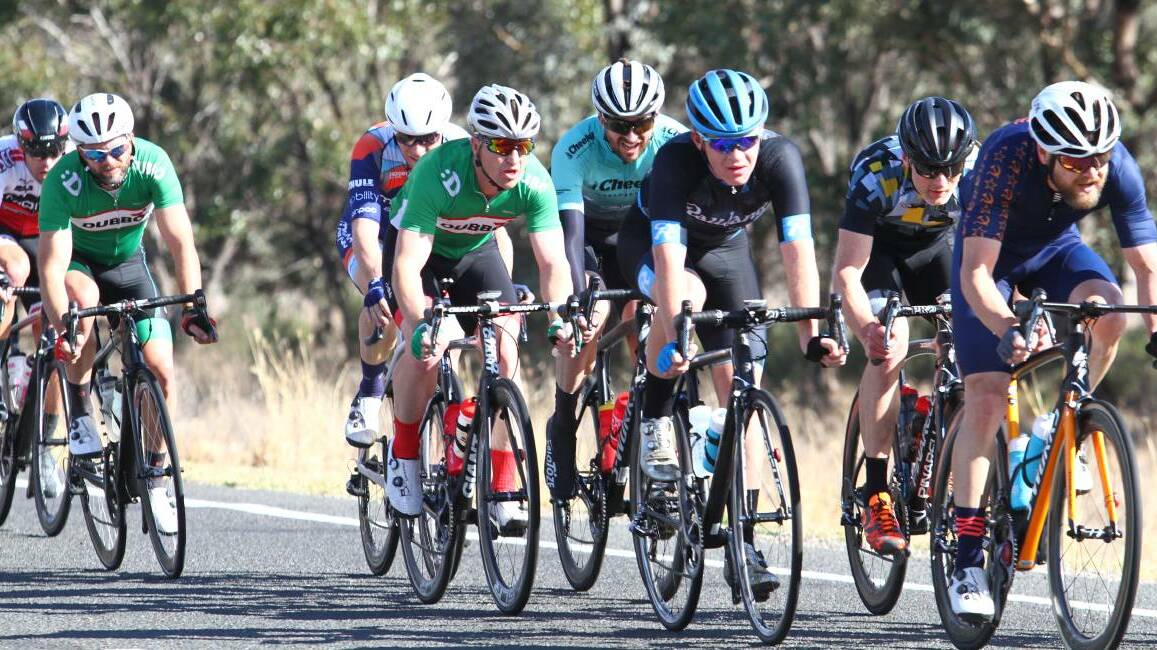 TESTING: Eventual winner Kurt Eather, second from the right, deals with a strong crosswind about 30 kilometres from the finish line during last years race.