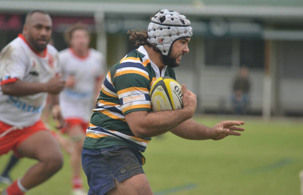 Valiant effort: Blake Clout, pictured here playing for New England at the recent Country Championships, was one of Tamworth's two tryscorers in their loss to Barbarians on Saturday, and also picked up the one point. Photo: Samantha Newsam
